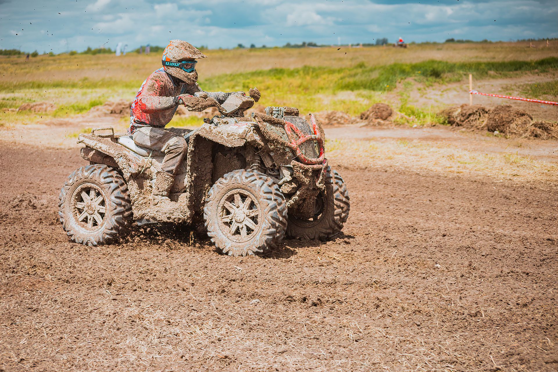 ATV pushing through mud
