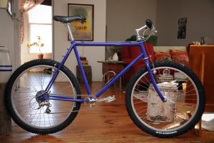 Blue push bike in a living room
