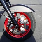 Harley Davidson wheel close up refurbished in red and black powder