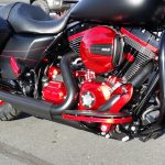 Side view of Harley Davidson refurbished in red and black powder