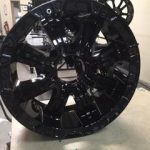 Large black powder coated wheel on display