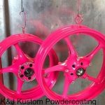 2 neon pink powder coated wheels cropped in